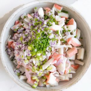 A creamy and refreshing seafood salad with imitation crab, celery, and a tangy dill dressing, perfect for summer gatherings or light lunches.