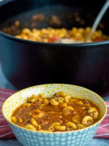 A comforting and hearty soup with beef, tomato broth, and tender macaroni, perfect for quick weeknight dinners or cozy meals.