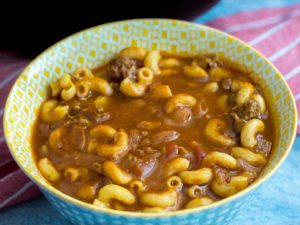 A comforting and hearty soup with beef, tomato broth, and tender macaroni, perfect for quick weeknight dinners or cozy meals.