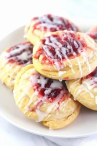 Sweet and flaky mini Danishes filled with cream cheese and cherries, perfect for breakfast or dessert.