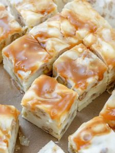 Creamy white chocolate fudge with crunchy pecans and a caramel swirl, perfect for holidays or any special occasion.