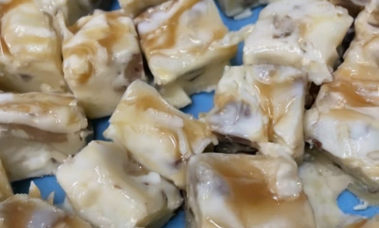 Creamy white chocolate fudge with crunchy pecans and a caramel swirl, perfect for holidays or any special occasion.