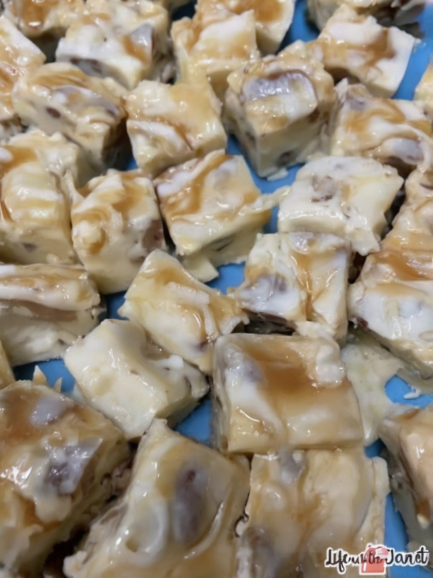 Creamy white chocolate fudge with crunchy pecans and a caramel swirl, perfect for holidays or any special occasion.