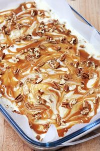 Creamy white chocolate fudge with crunchy pecans and a caramel swirl, perfect for holidays or any special occasion.