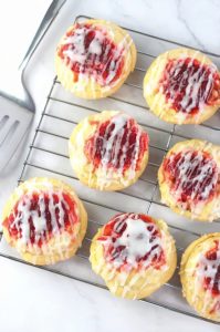 Sweet and flaky mini Danishes filled with cream cheese and cherries, perfect for breakfast or dessert.